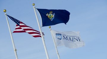 University of Maine flags (UMaine, state, and national)