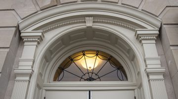 Photo of a window above a door